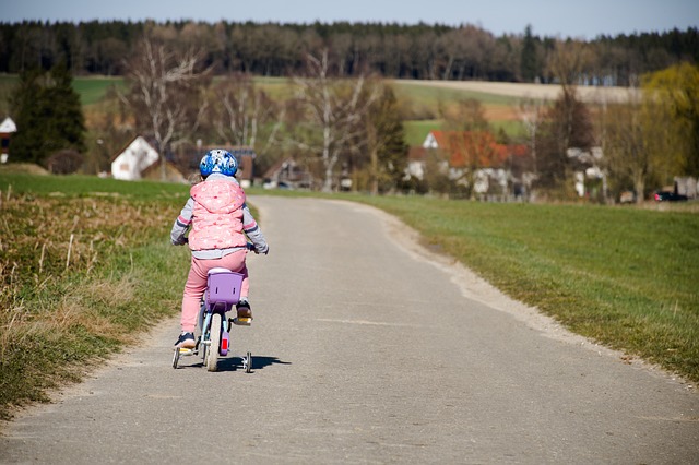 child, bicycle, dirt road